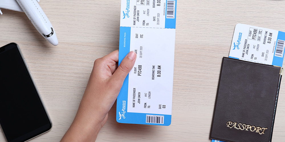Preparing passport and flight ticket to register with Visit Japan Web